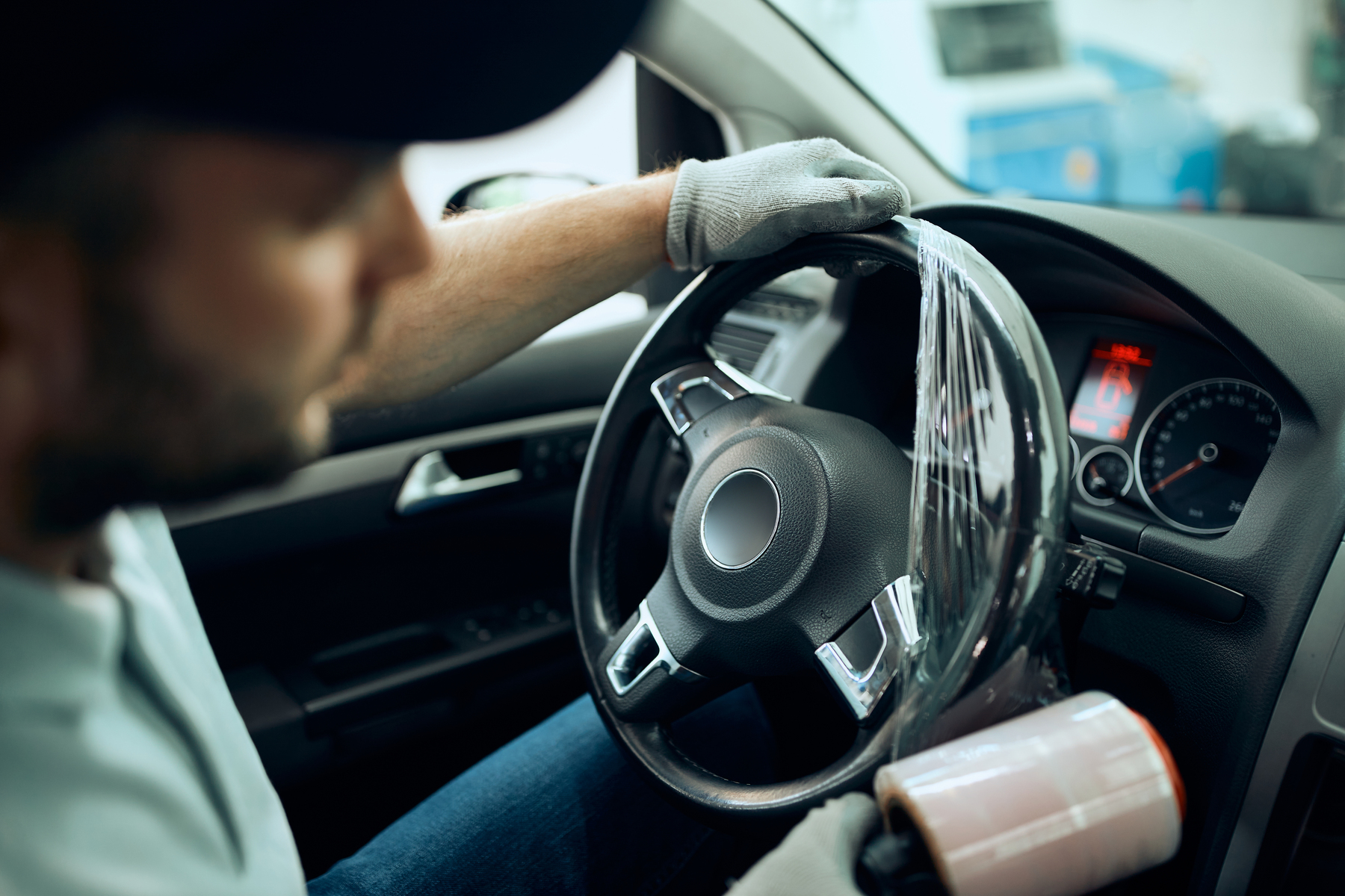 close up of mechanic wrapping steering wheel with 2023 11 27 05 22 38 utc.jpg