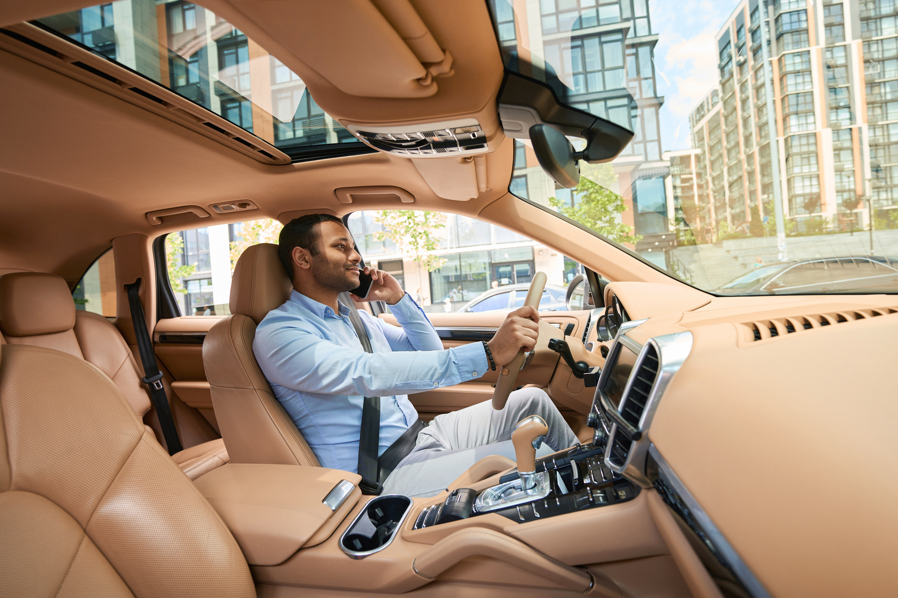 driver with smartphone in hand driving automobile 2023 11 27 05 15 54 utc.jpg