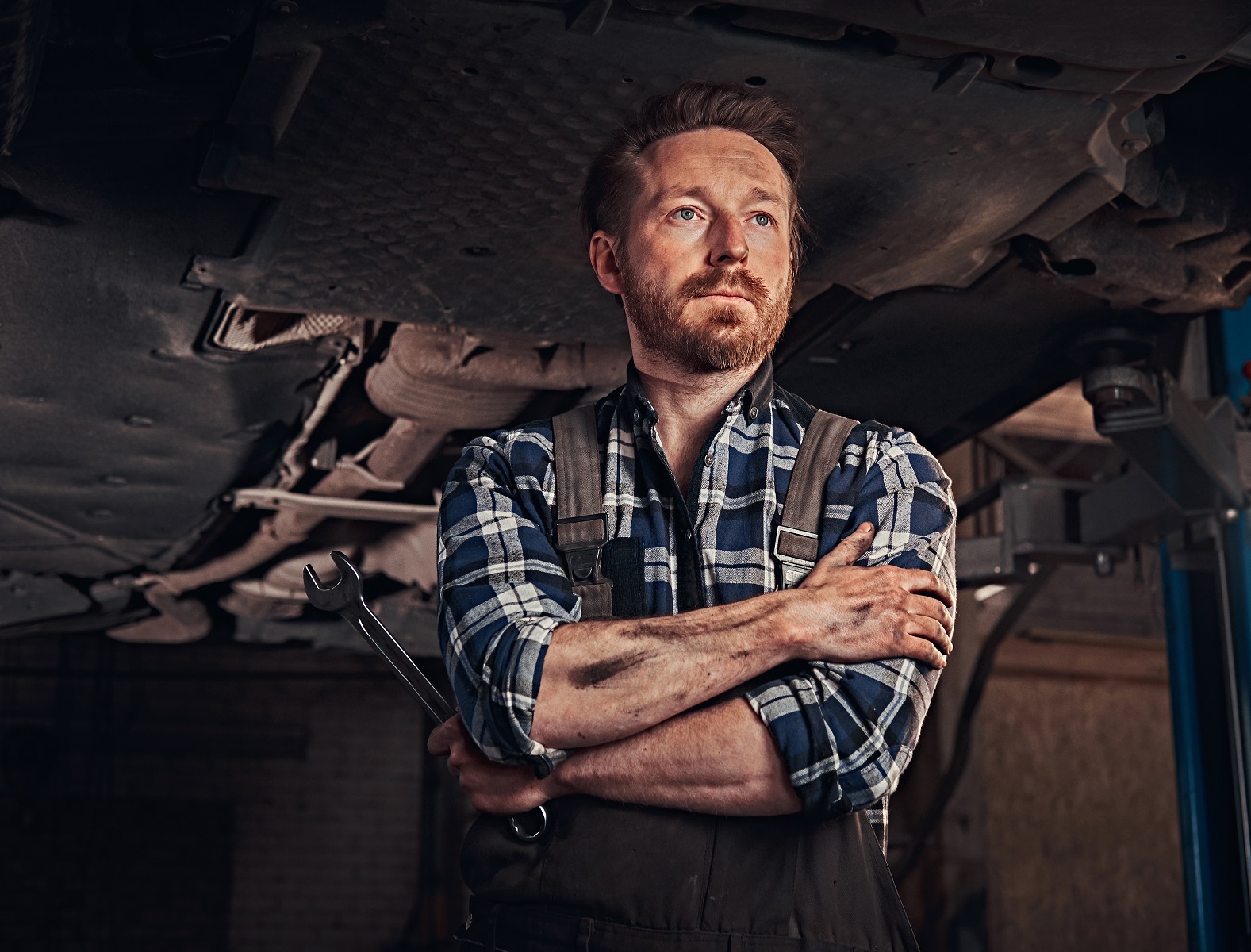 two bearded drone technician working in repair garage jfevppc.jpg